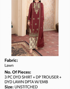 Maroon traditional outfit with intricate patterns on a patterned carpet