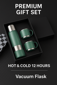 Man sitting on a couch drinking from a green thermos.