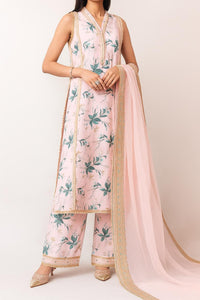 Woman wearing a floral dress with a pink dupatta on a white background